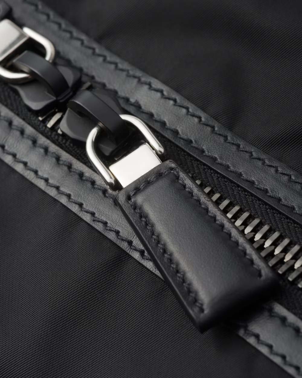 Re-Nylon and leather travel bag